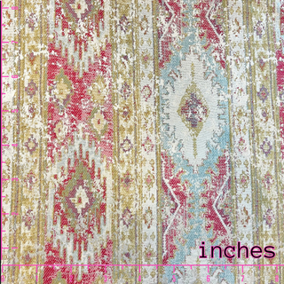 Hues of gold, deep pink, and soft blues woven in a beautiful native texture print