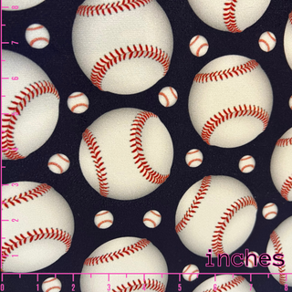 Bl;ack vouge velvet with baseballs in various sizes. 